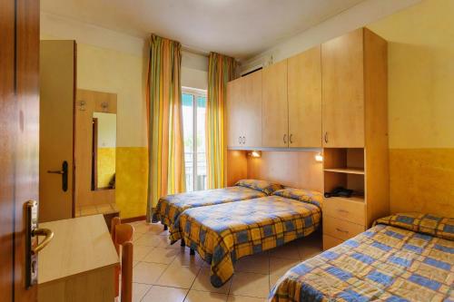 Postel nebo postele na pokoji v ubytování Hotel Canova