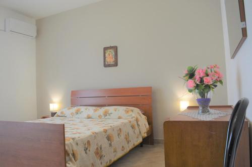 A bed or beds in a room at Etna - Taormina