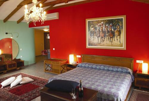 a bedroom with a bed and a painting on the wall at Akti in Nafpaktos