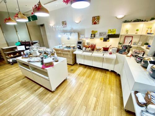a store with white counters in a room at Hotel Wing International Tomakomai in Tomakomai