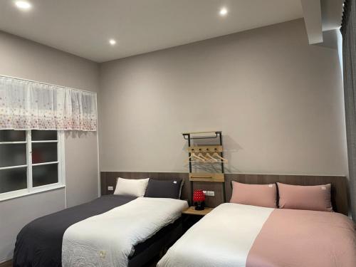 Postel nebo postele na pokoji v ubytování 札秝悅 Zali House