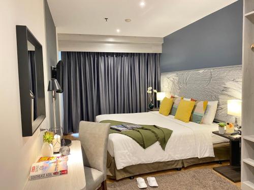 เตียงในห้องที่ Evergreen Place Siam by UHG