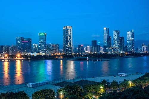 a view of a city skyline at night at Crowne Plaza Fuzhou South by IHG in Fuzhou