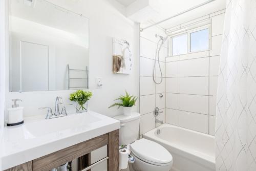 a white bathroom with a sink and a toilet at Well-Stocked, Family Friendly Home on the Westside STR-1669 in Colorado Springs