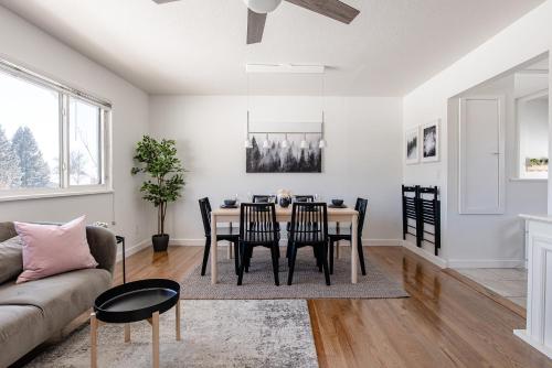 a dining room and living room with a table and chairs at Well-Stocked, Family Friendly Home on the Westside STR-1669 in Colorado Springs