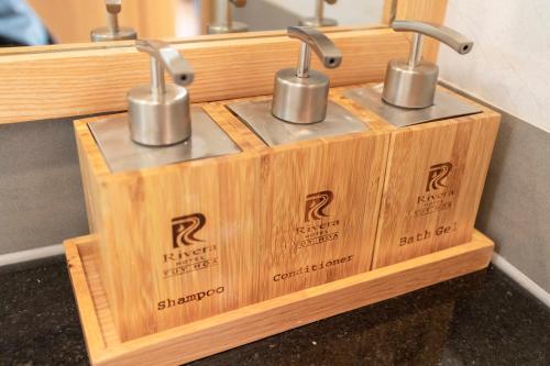 a wooden box with three r finishes on it at Rivera Tuy Hòa Hotel in Tuy Hoa