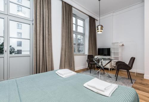 Posteľ alebo postele v izbe v ubytovaní Rent like home - Księcia Józefa Poniatowskiego 2