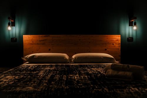 a bedroom with a large bed with a wooden headboard at TRAVEL STATION Bedandbreakfast in Bari