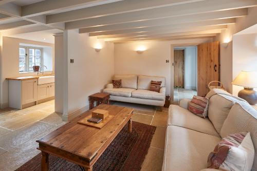 a living room with a couch and a table at Host & Stay - The Cobbles in Osmotherley