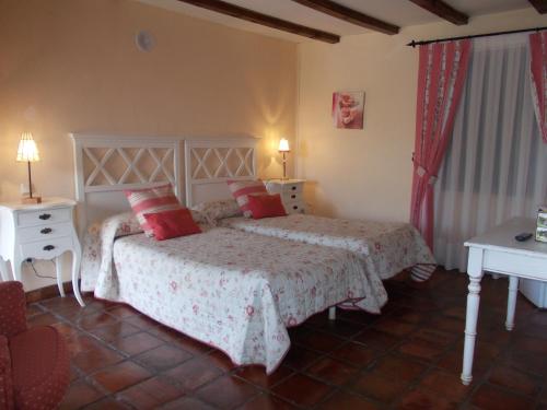 מיטה או מיטות בחדר ב-Hotel Los Rastrojos