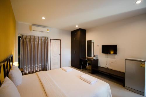 Postelja oz. postelje v sobi nastanitve Somsamai Style Apartment