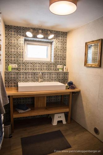 a bathroom with a sink and a window at Grenzhaus in Karlstift
