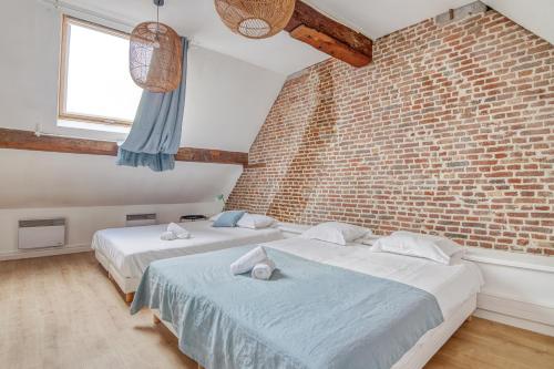 Postel nebo postele na pokoji v ubytování NOCNOC - Le Soprano, Monnaie