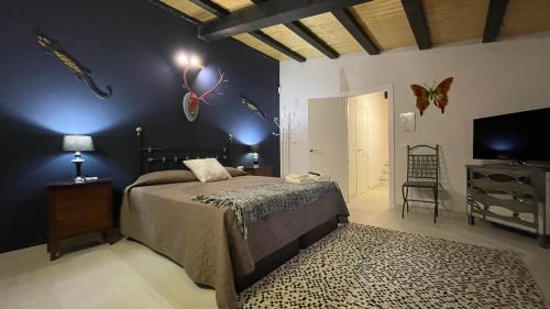 Posteľ alebo postele v izbe v ubytovaní Apartamentos Rurales Casa Josefita