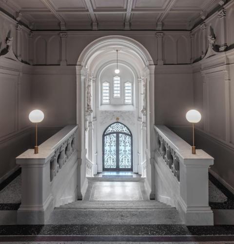 a hallway of a building with a window and stairs at MN6 Luxury Suites by Adrez in Prague