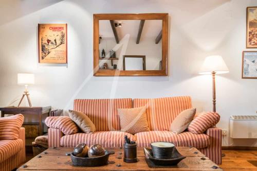 a living room with a couch and a table at Amitges by SeaMount Rentals in Baqueira-Beret