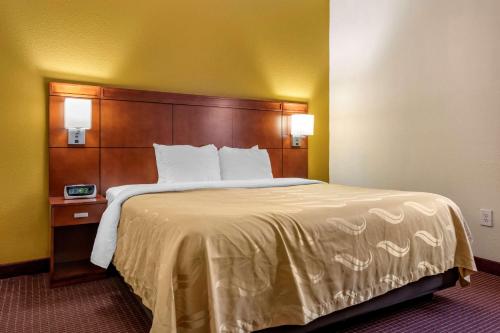 a bed in a hotel room with a large bed at Quality Inn Zephyrhills-Dade City in Zephyrhills
