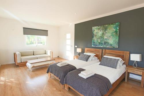 Postel nebo postele na pokoji v ubytování TESS Rancho Las Palmeras