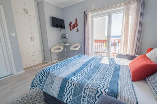 Postel nebo postele na pokoji v ubytování Apartmani Villa Mila