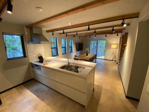 a kitchen with a sink and a counter top at Stella House ステラハウス in Fujikawaguchiko