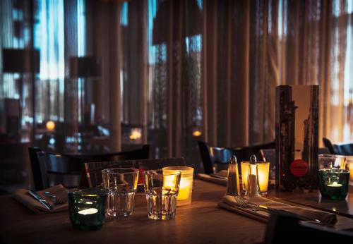 a table in a restaurant with glasses on it at Comfort Hotel Sello in Espoo
