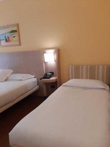 Katil atau katil-katil dalam bilik di Hotel Chiaraluna