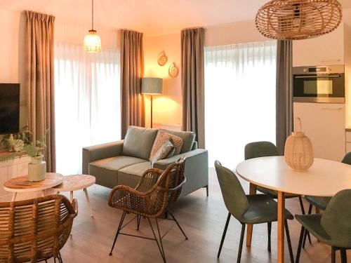 a living room with a couch and a table at Holiday Home Citta Romana-1 by Interhome in Hellevoetsluis