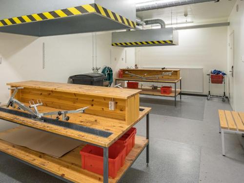 a workshop with a table and tools in it at Holiday Home Nordic chalet 9102 by Interhome in Ylläsjärvi