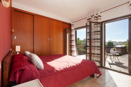 سرير أو أسرّة في غرفة في Villa Sa Torre