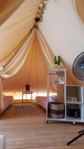a room with a tent with a bed in it at Camping Aloa in Bol