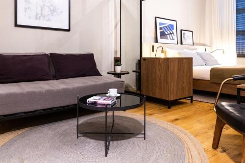 a living room with a couch and a coffee table at Guest House de la Valette in Valletta