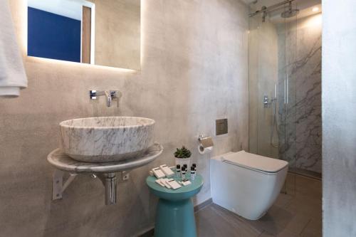 a bathroom with a sink and a toilet at Guest House de la Valette in Valletta