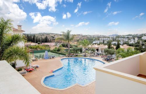 a view of the pool from the balcony of a resort at Villa Albufeira in Albufeira
