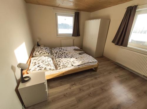 Ein Bett oder Betten in einem Zimmer der Unterkunft Apartmány PRO LIPNO