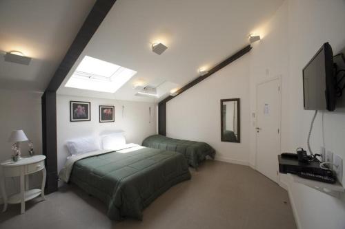 Säng eller sängar i ett rum på Gaia Hostel