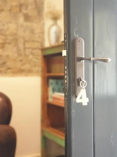 a lock on a door with a number four on it at Mas Ferran Adults Only in Pals