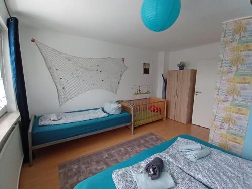 Postel nebo postele na pokoji v ubytování Ferienwohnung Leuchtturm mit E-Bike Verleih