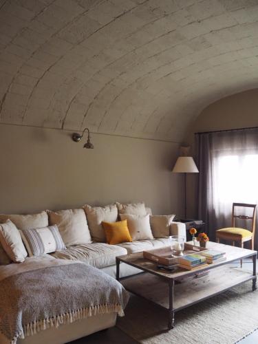 a living room with a couch and a coffee table at Mas Ferran Adults Only in Pals