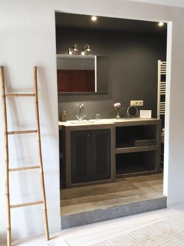 a bathroom with a sink and a mirror at Mas Ferran Adults Only in Pals