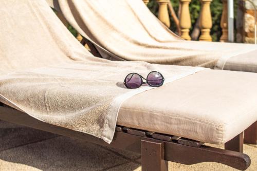 a pair of sunglasses sitting on top of a bench at Ca'n Beneït in Binibona
