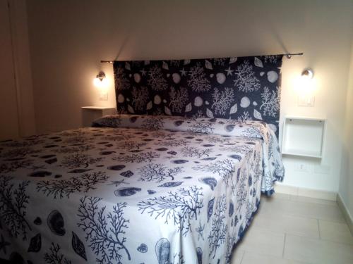 En eller flere senge i et værelse på La Casa Delle Conchiglie