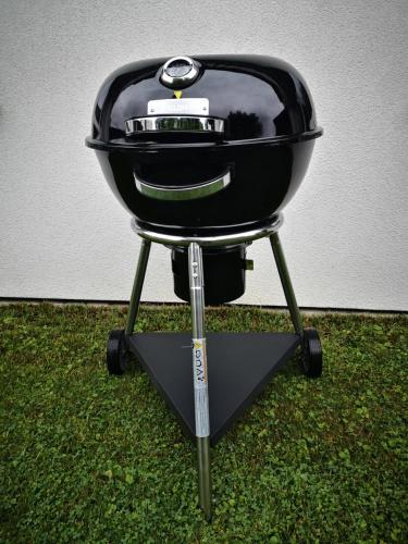 a black grill sitting on top of some grass at Villa- Caba in Křemže
