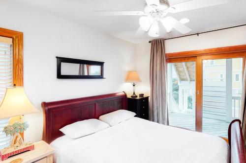a bedroom with a bed and a ceiling fan at 7 Day Weekend #33-S in Salvo