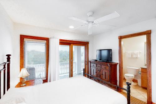 a bedroom with a bed and a flat screen tv at 7 Day Weekend #33-S in Salvo