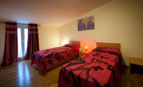 Postel nebo postele na pokoji v ubytování Belvedere Baiocco