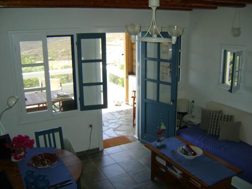 a living room with a couch and a table at Chez Semiramis The Sun Touch House for 8 persons 5'min from the beach in Rámos