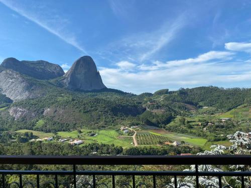 a view of a mountain from a balcony at Apart Pedra Azul in Pedra Azul