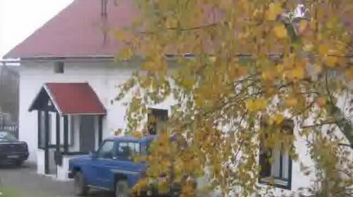 a blue truck parked in front of a house at The Bohemian Farmhouse in Česká Bělá