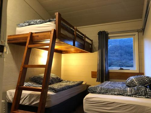Postel nebo postele na pokoji v ubytování Aneeki Ski Lodge