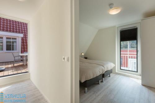 Postel nebo postele na pokoji v ubytování Appartement - Kaapduinseweg 13 Dishoek 13E Luxe 6 personen